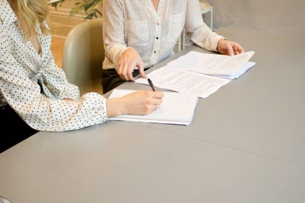 woman signing testamentary trusts